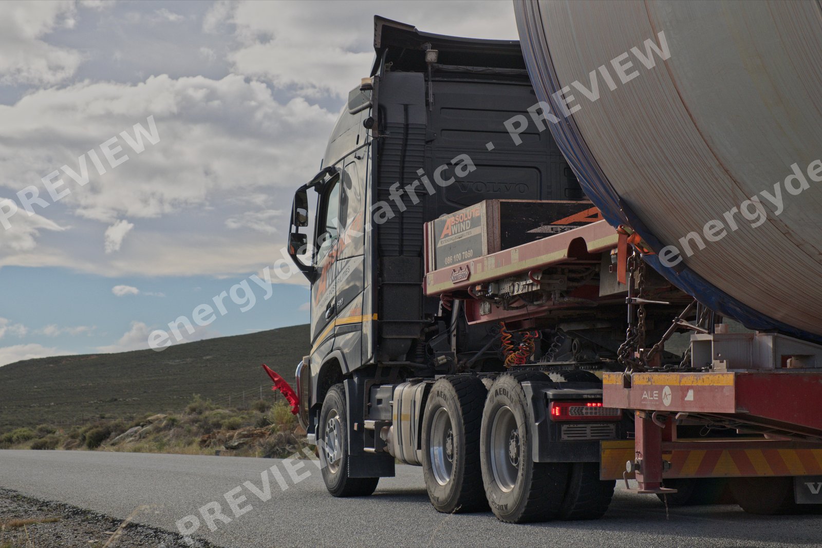 Heavy-haulage truck carrying a wind turbine tower section