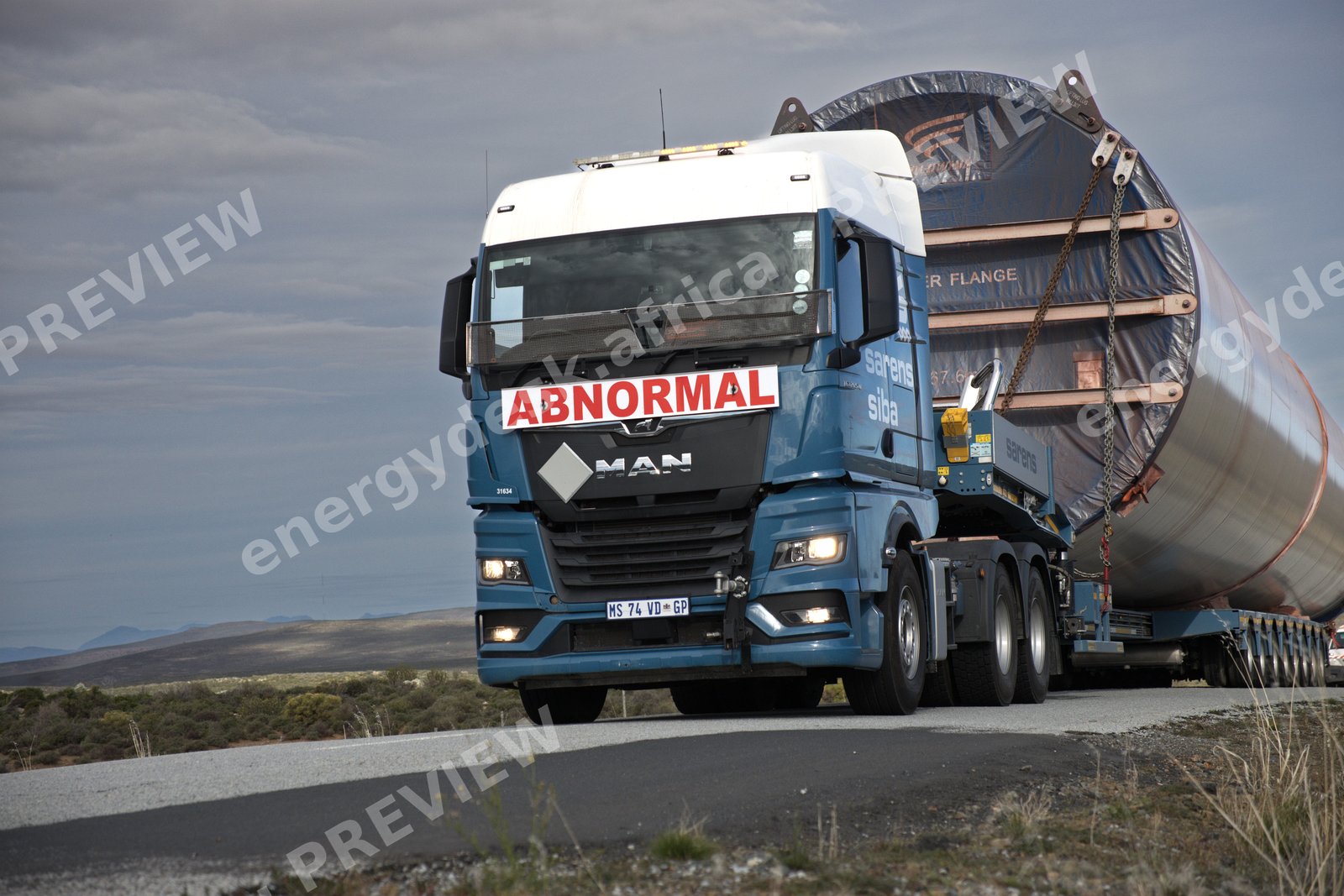 MAN abnormal-load truck hauling a wind tower flange section