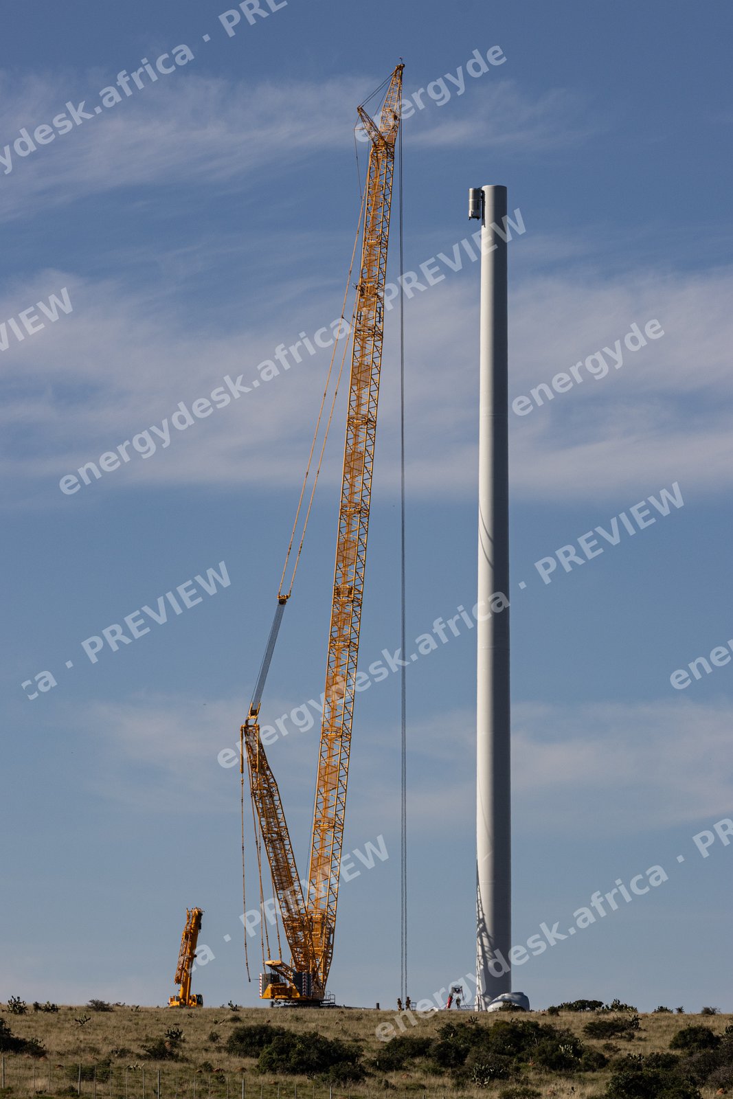 Crawler crane beside a freshly erected tower, Wind Garden Wind Farm